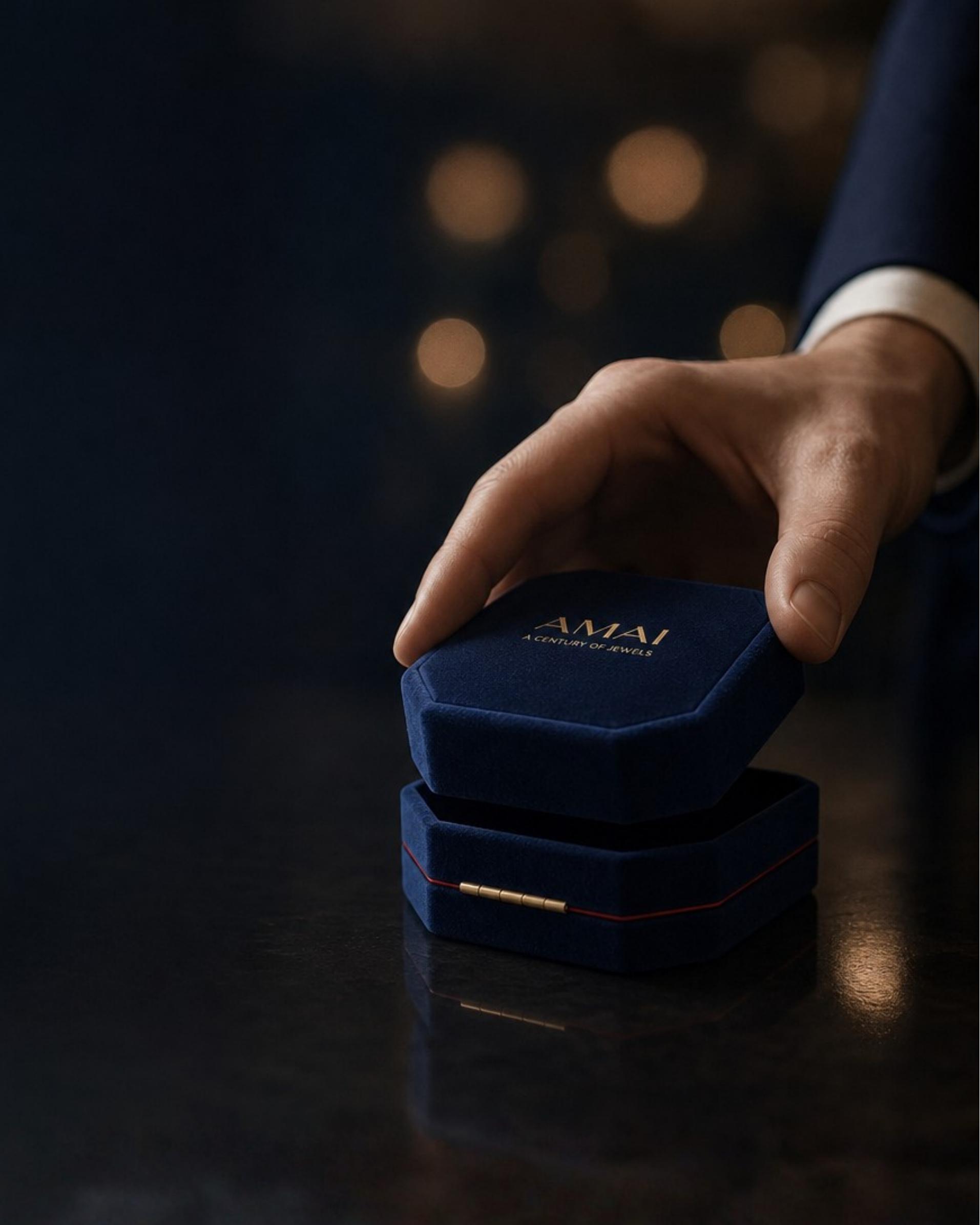 An AMAI jewellery box being presented